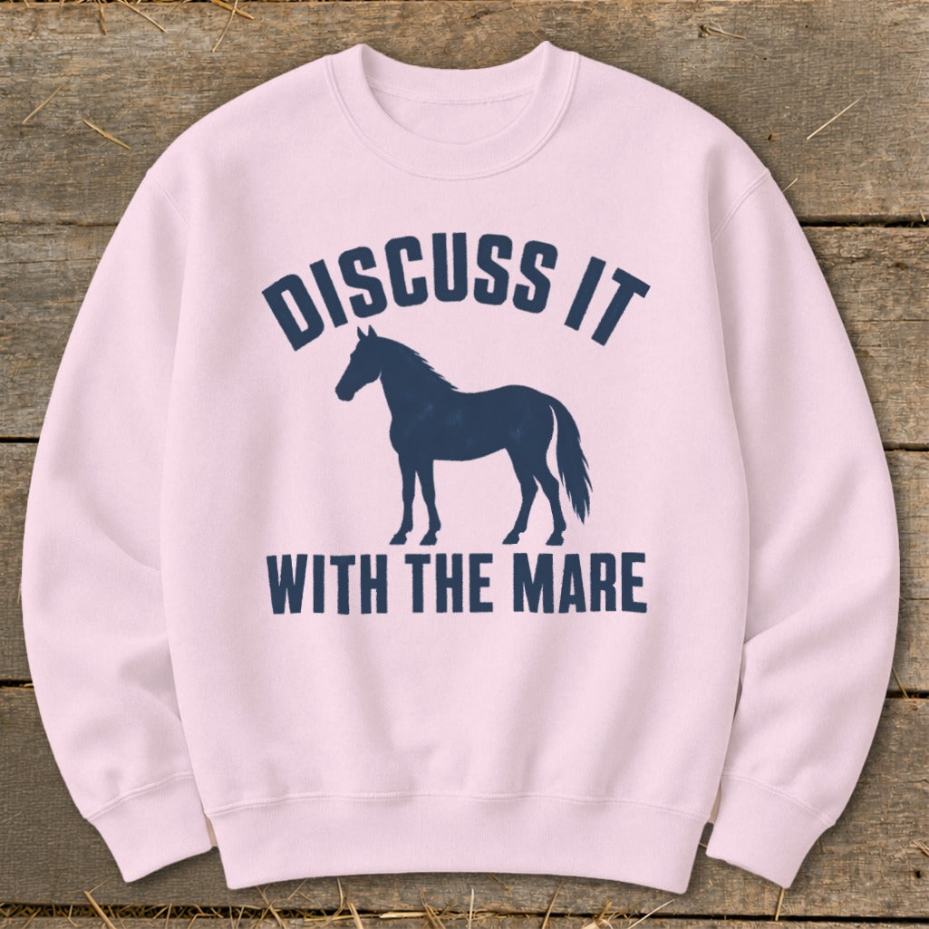 Pink sweatshirt with navy blue horse silhouette and text "Discuss It With The Mare".