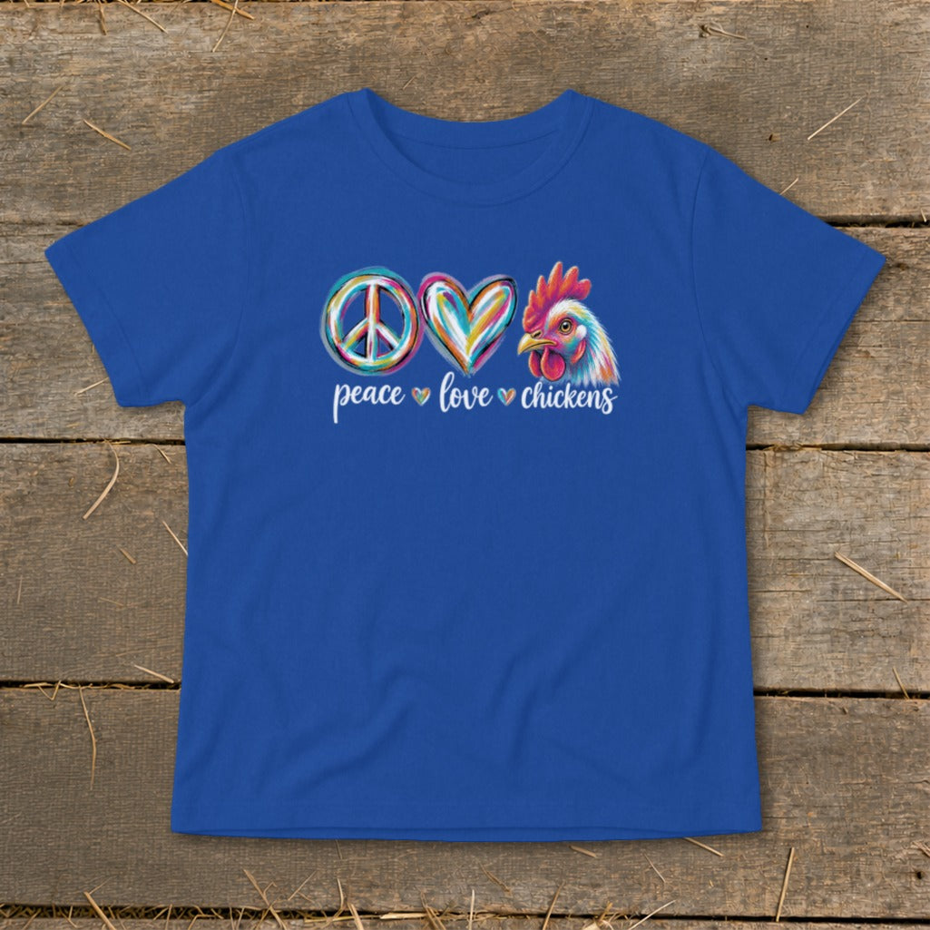 Blue t-shirt with colorful peace sign, heart, and chicken graphic and text.