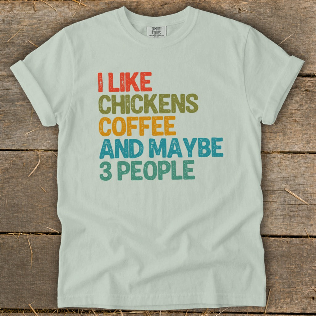 Light green t-shirt with "I like chickens coffee and maybe 3 people" text.