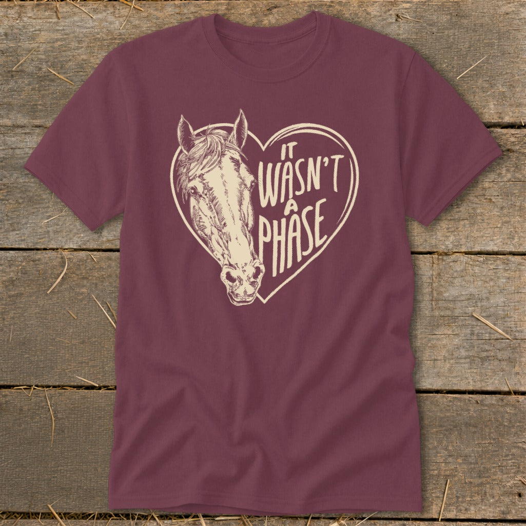 Maroon t-shirt with a horse head inside a heart, reading "It wasn't a phase."