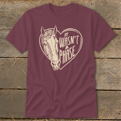 Maroon t-shirt with a horse head inside a heart, reading "It wasn't a phase."