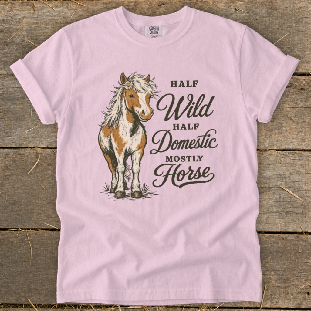Pink t-shirt with a brown and white horse graphic and text reading Half Wild Half Domestic Mostly Horse.