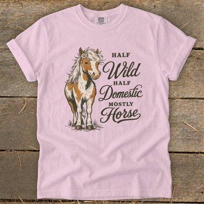 Pink t-shirt with a brown and white horse graphic and text reading Half Wild Half Domestic Mostly Horse.