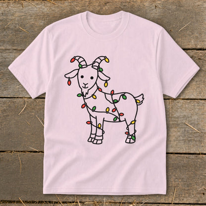 Pink t-shirt with a cartoon goat wrapped in colorful Christmas lights.