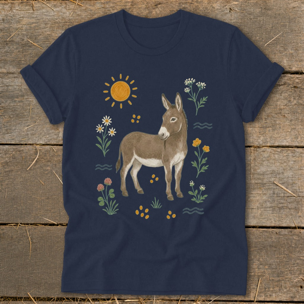 Navy t-shirt with illustration of a donkey surrounded by flowers, sun, and water elements.