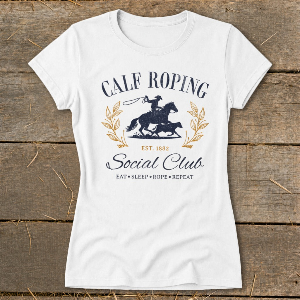 White t-shirt with "Calf Roping Social Club" graphic and cowboy rodeo scene.
