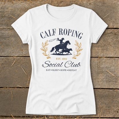 White t-shirt with "Calf Roping Social Club" graphic and cowboy rodeo scene.