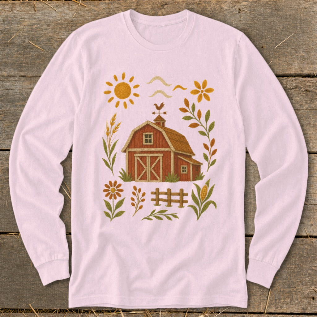 Pink long-sleeve shirt with a rustic barn and farm-themed graphic.