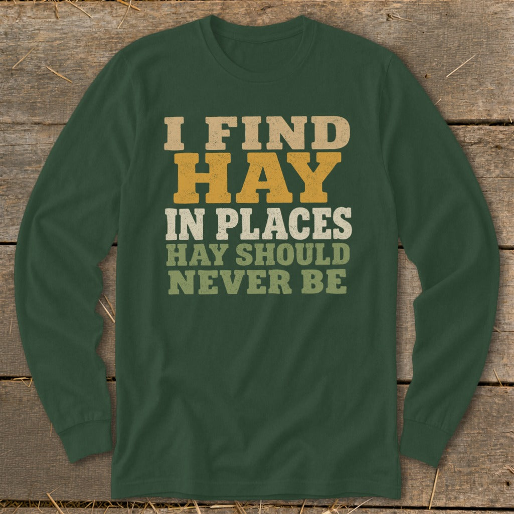 Green long-sleeve shirt with text "I FIND HAY IN PLACES HAY SHOULD NEVER BE".