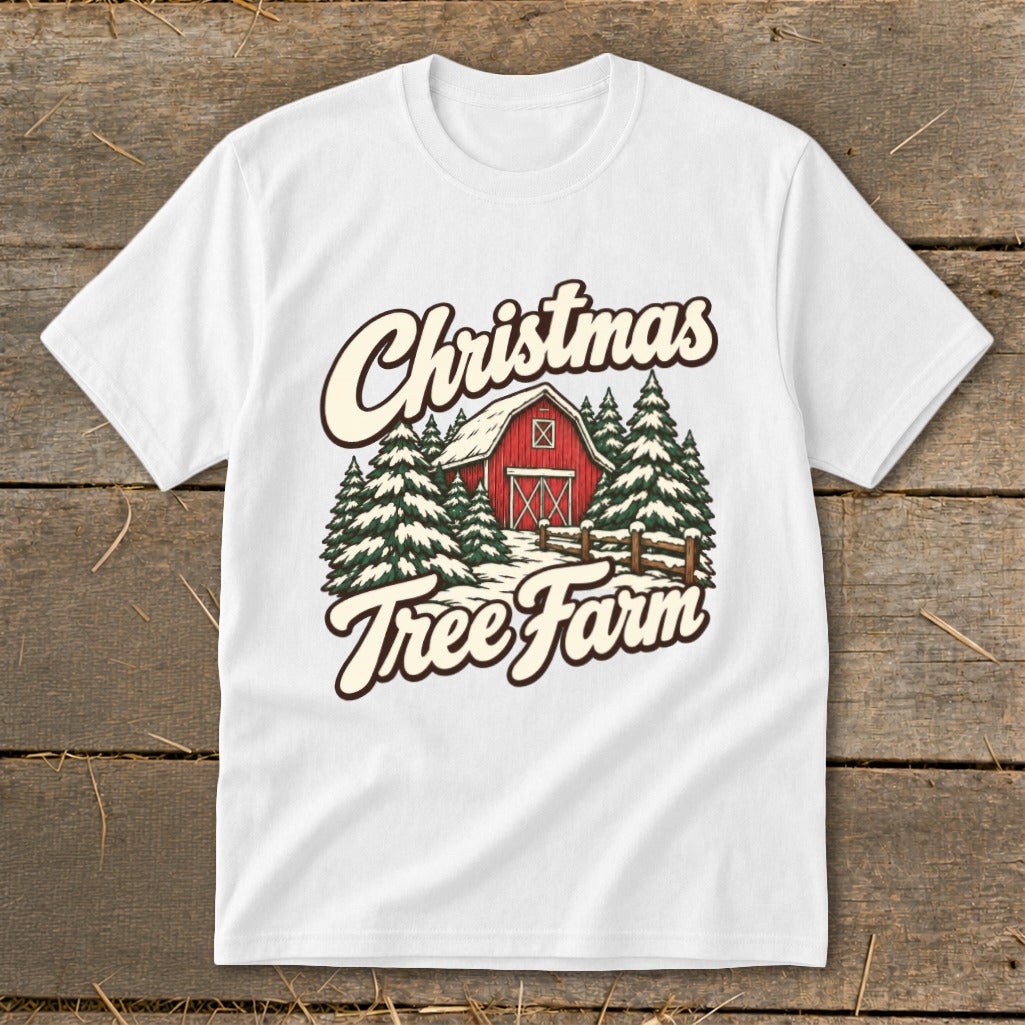 White t-shirt with Christmas Tree Farm graphic featuring a red barn and snow-covered trees.