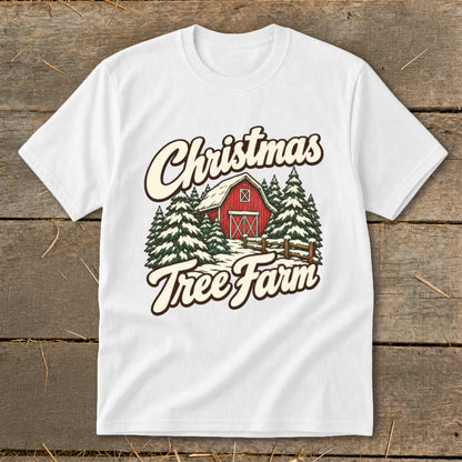 White t-shirt with Christmas Tree Farm graphic featuring a red barn and snow-covered trees.