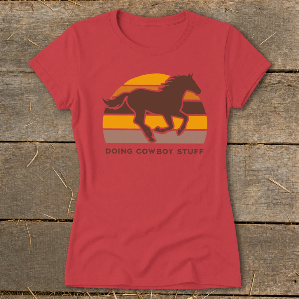 Red t-shirt with brown running horse graphic and "Doing Cowboy Stuff" text.