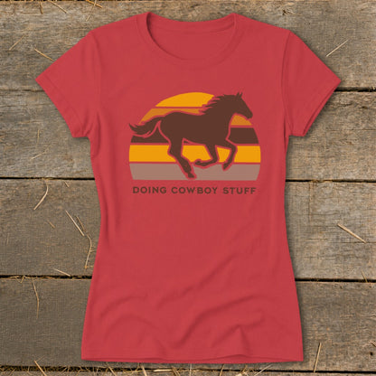Red t-shirt with brown running horse graphic and "Doing Cowboy Stuff" text.