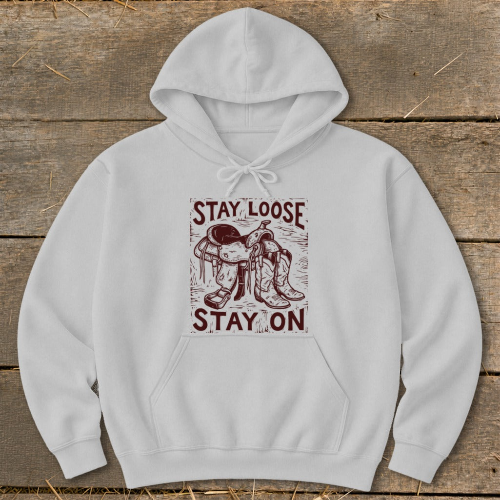White hoodie with "STAY LOOSE STAY ON" text and saddle graphic.