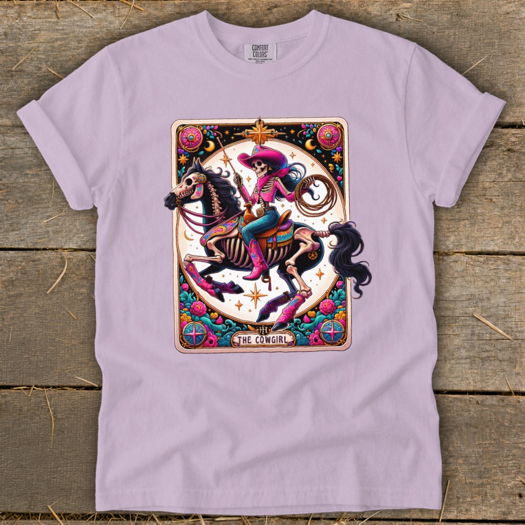 Skeleton cowgirl on horse, with lasso, in colorful tarot card style.