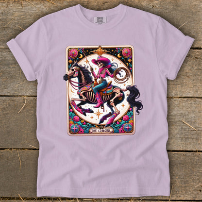 Skeleton cowgirl on horse, with lasso, in colorful tarot card style.