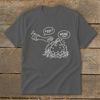 T-shirt with a white line drawing of a chicken on a nest of eggs, being approached by a hand.