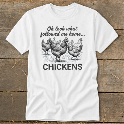 White t-shirt with chickens graphic and text "Oh look what followed me home... CHICKENS".