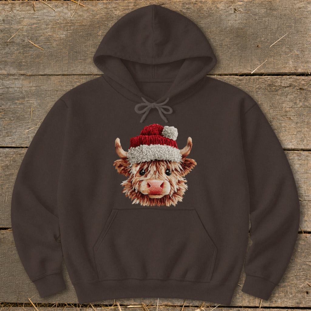 Brown hoodie with a fluffy highland cow wearing a Santa hat graphic.