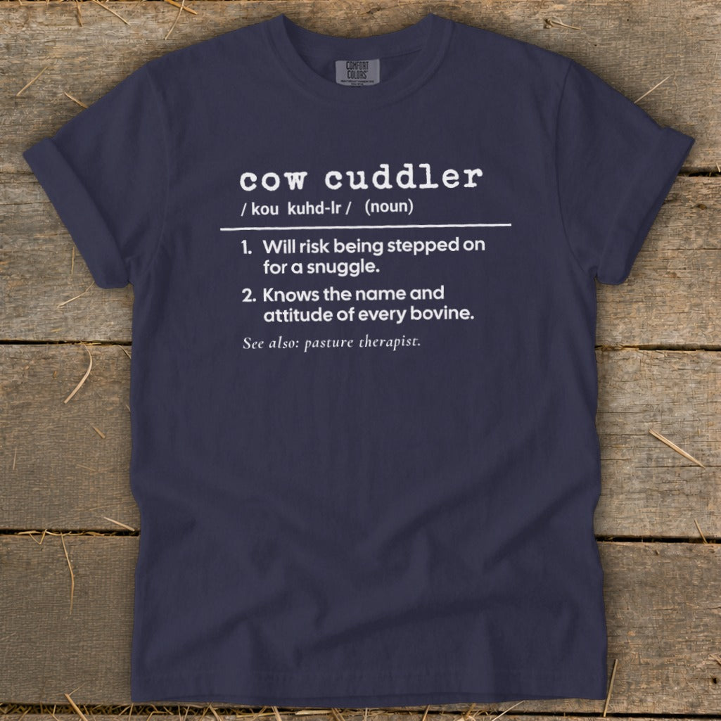 Navy t-shirt with "cow cuddler" definition: "Will risk being stepped on for a snuggle."