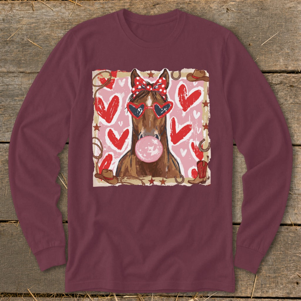 Horse with heart sunglasses and red bandana blowing bubblegum, surrounded by hearts and western elements.