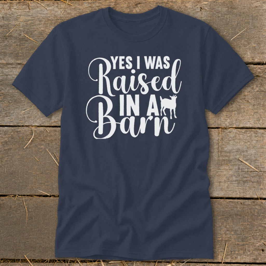 Navy t-shirt with white text "Yes I Was Raised In A Barn" and goat silhouette.