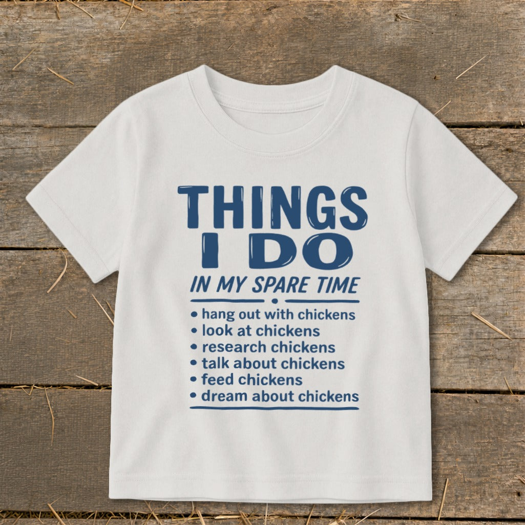 White t-shirt with blue text: "THINGS I DO IN MY SPARE TIME" and a list of chicken-related activities.