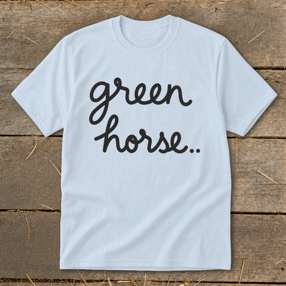 Light blue t-shirt with black cursive text "green horse.."