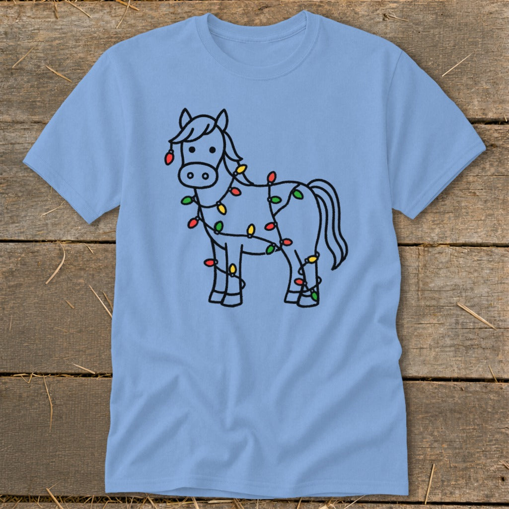 Light blue t-shirt with a black line drawing of a horse covered in colorful Christmas lights.