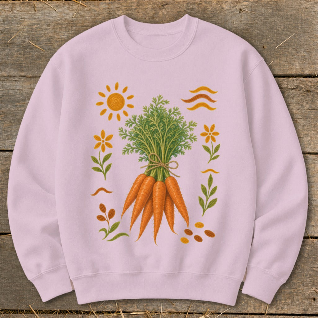 Pink sweatshirt with a bunch of carrots and surrounding floral and sun illustrations.