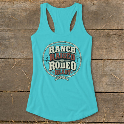 Turquoise tank top with "Ranch Raised Rodeo Ready" text in a circular rope design.