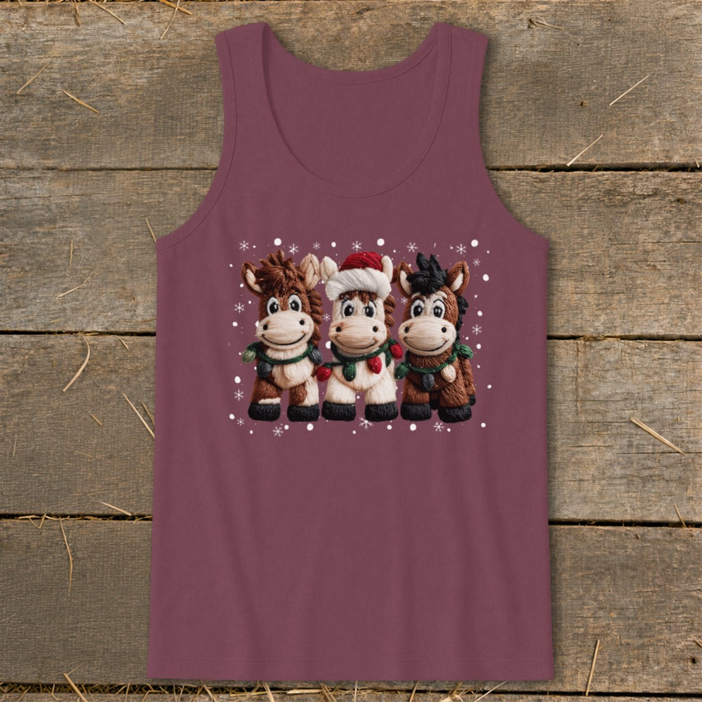 Three cartoon horses wearing Christmas decorations and a Santa hat, surrounded by snowflakes.