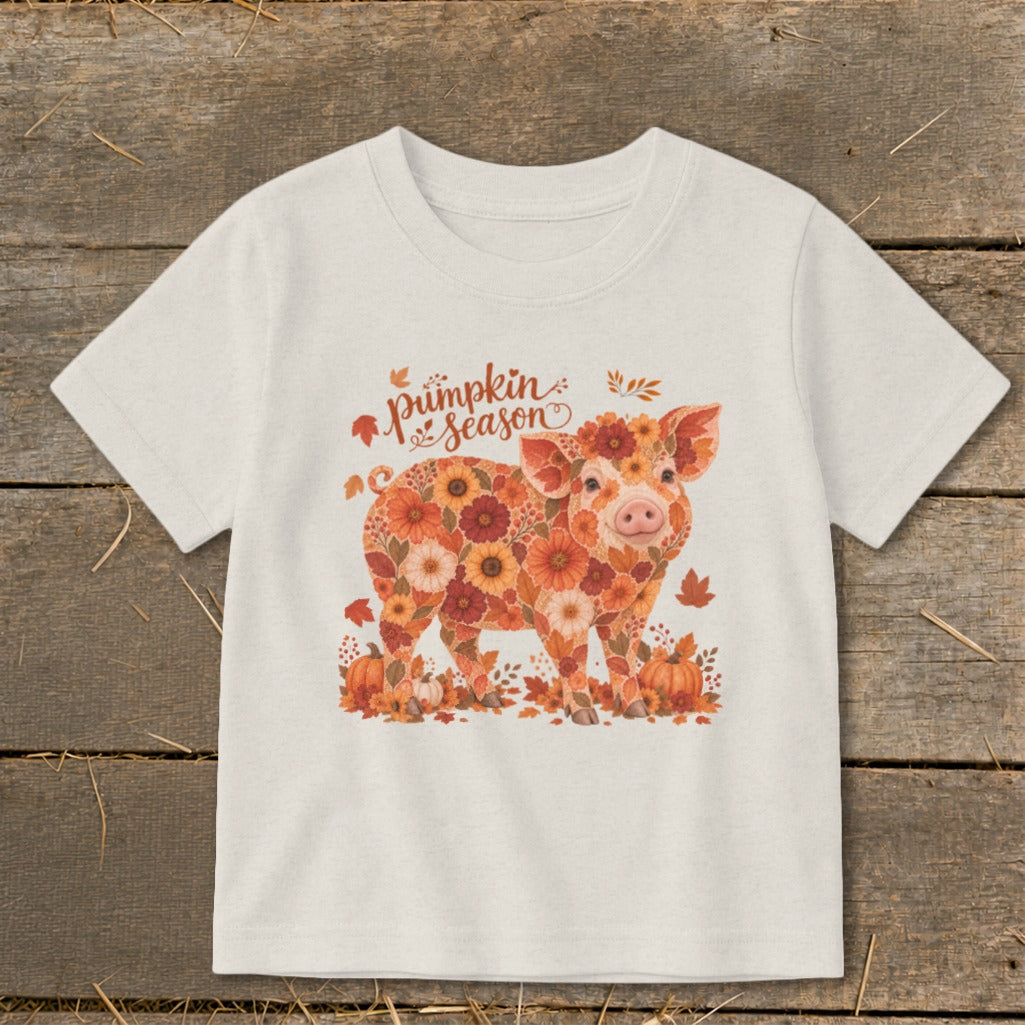 T-shirt with floral pig graphic and "pumpkin season" text.