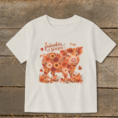 T-shirt with floral pig graphic and "pumpkin season" text.