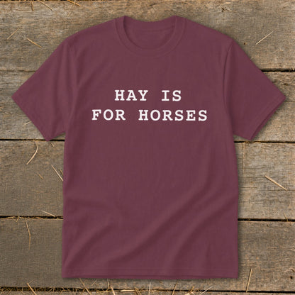 Maroon t-shirt with white text "HAY IS FOR HORSES".