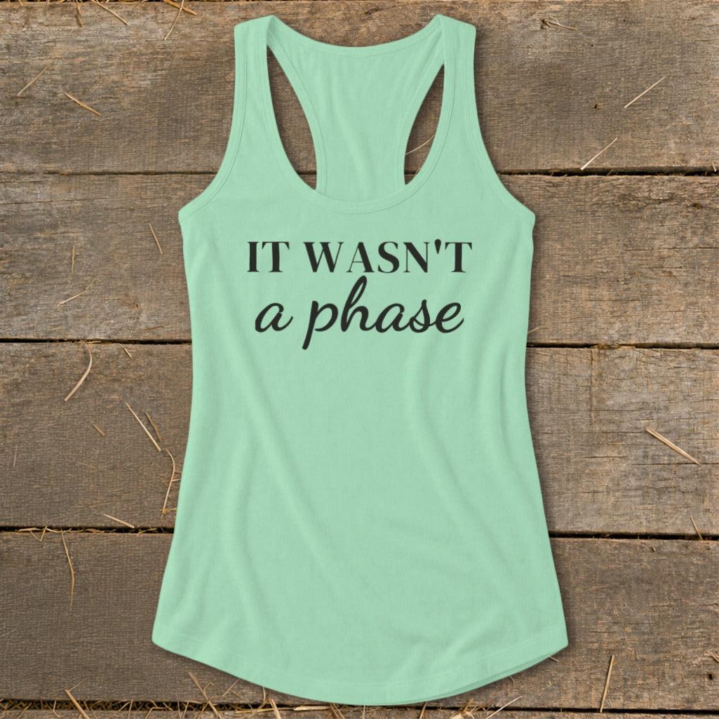 Mint green racerback tank top with black text "IT WASN'T a phase".
