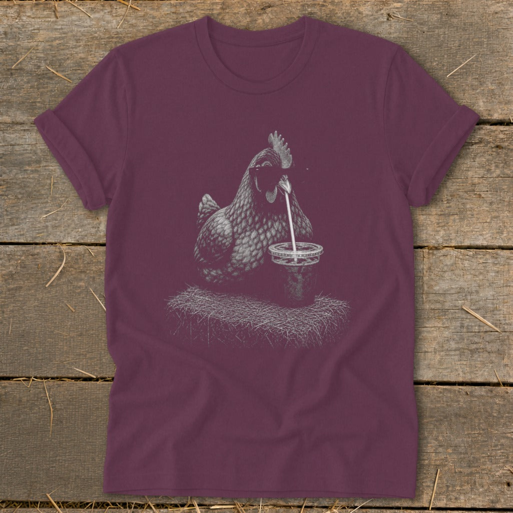 T-shirt with line drawing of chicken drinking from a cup with a straw.