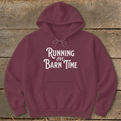 Maroon hoodie with white text that reads "Running on Barn Time".