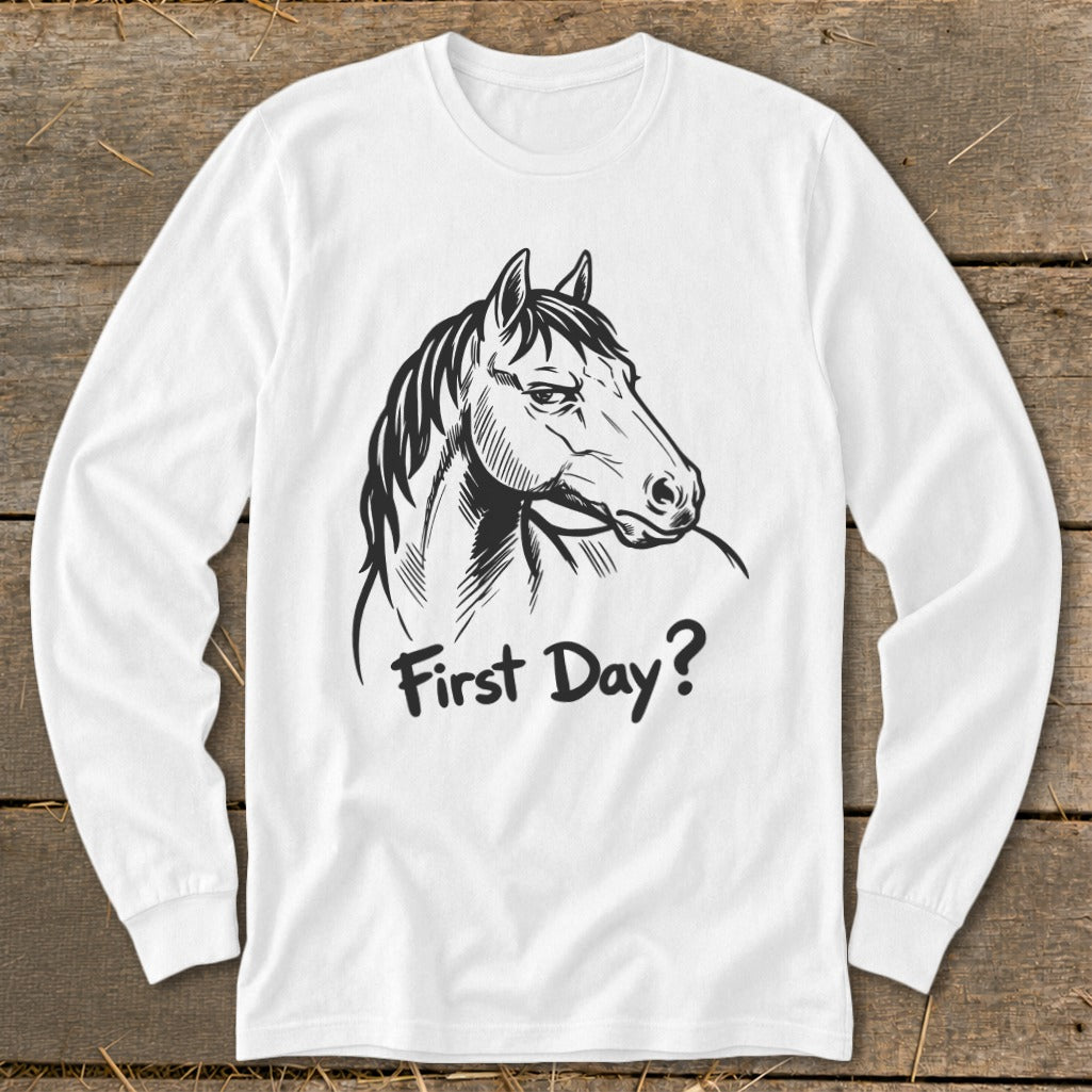 White long-sleeve shirt with black line drawing of a horse and text "First Day?".