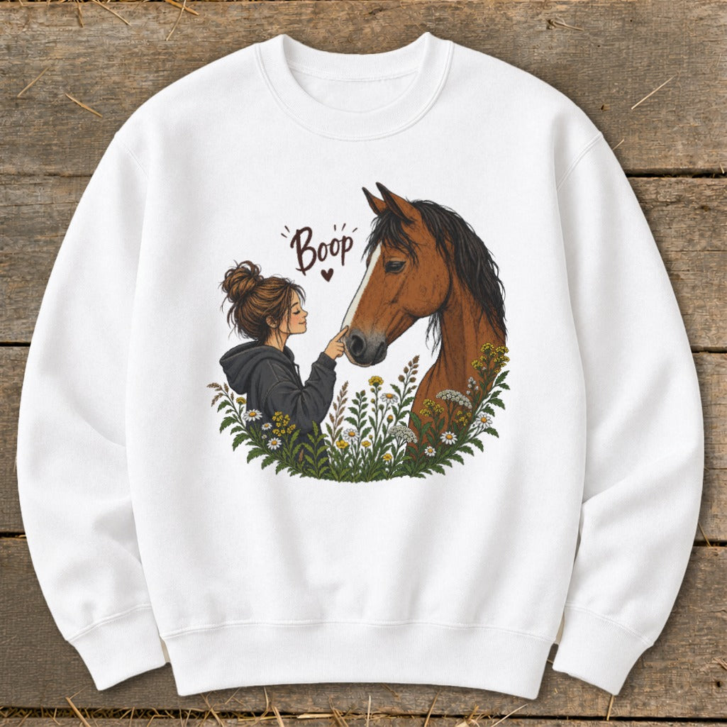 Girl booping a horse's nose with "Boop" text above.