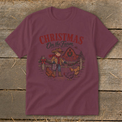 Maroon short-sleeved t-shirt featuring a retro graphic of a child feeding chickens outside a barn.