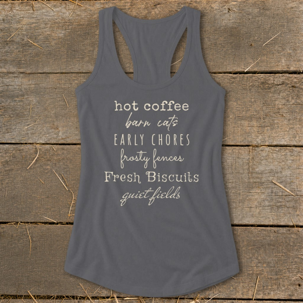 Gray tank top with "hot coffee barn cats EARLY CHORES frosty fences Fresh Biscuits quiet fields" text.
