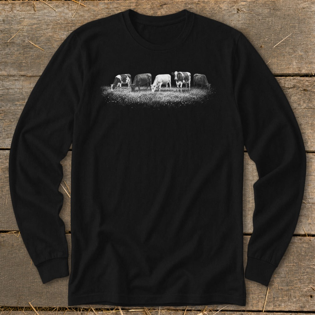 Black long-sleeve shirt with a graphic of five cows grazing in a field.