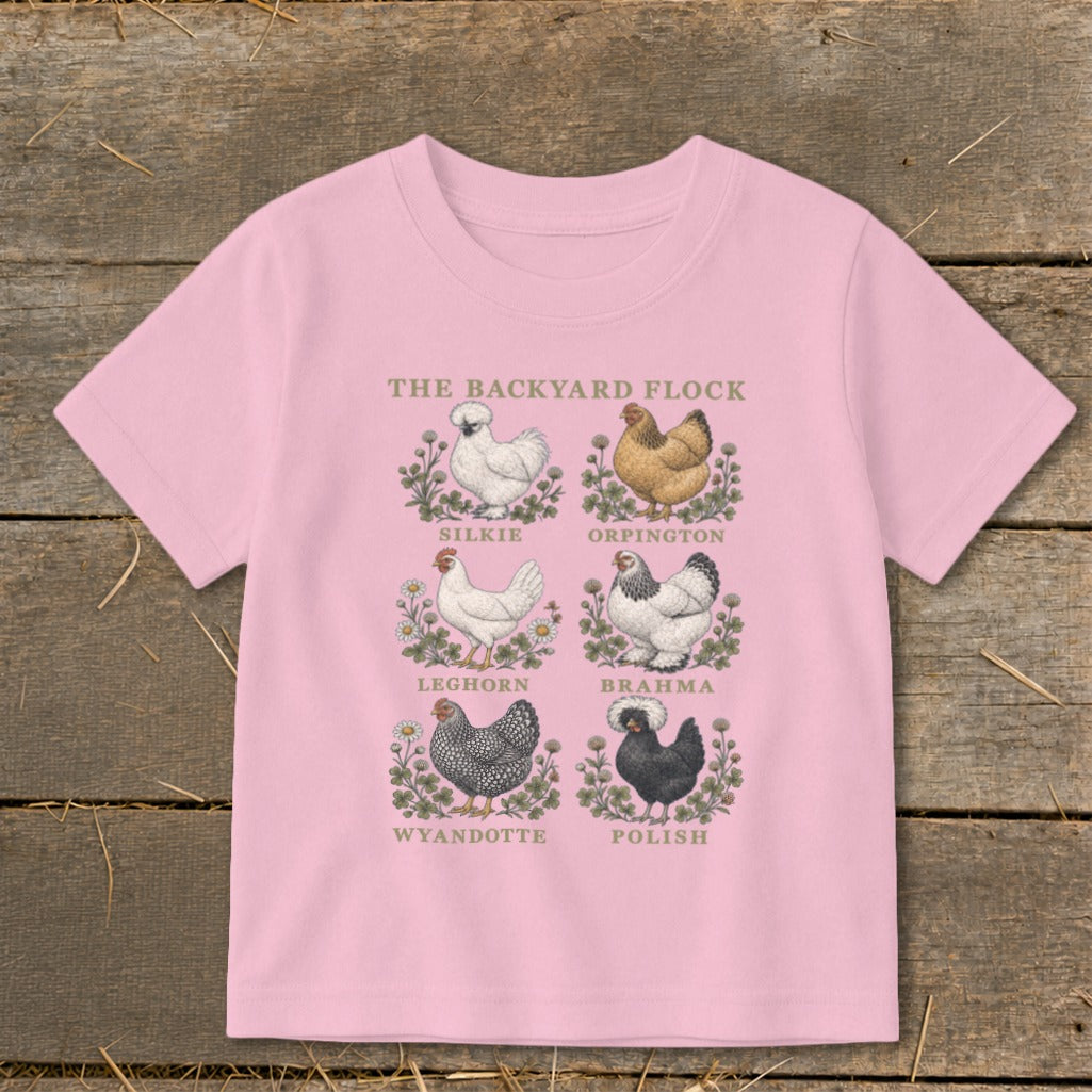 Pink t-shirt with six illustrated chicken breeds and the text "The Backyard Flock".