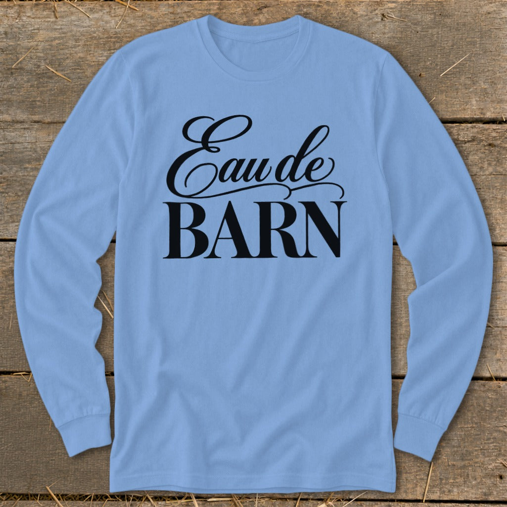 Light blue long-sleeve shirt with "Eau de BARN" text printed in black.