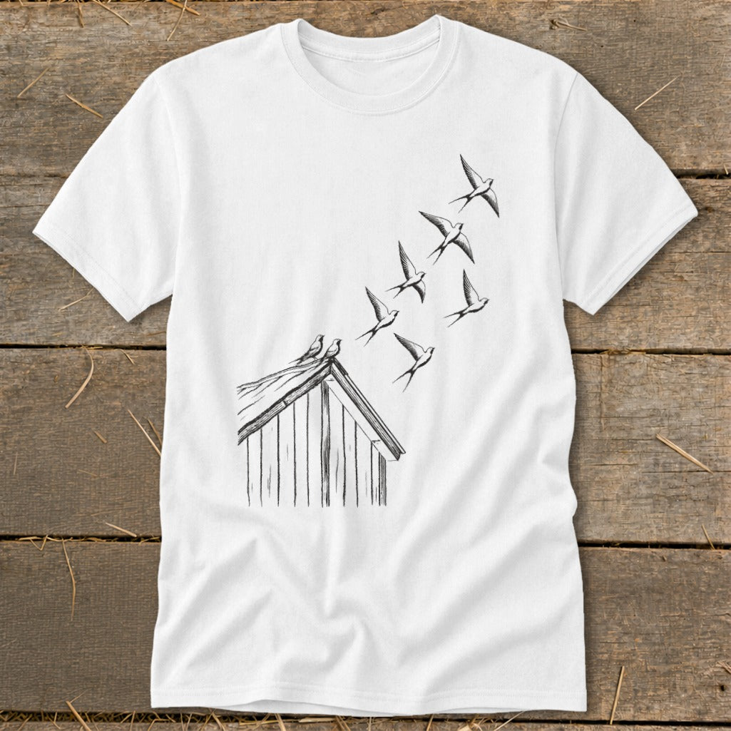 A white short-sleeved t-shirt featuring a black line art graphic of swallows flying from a rooftop.