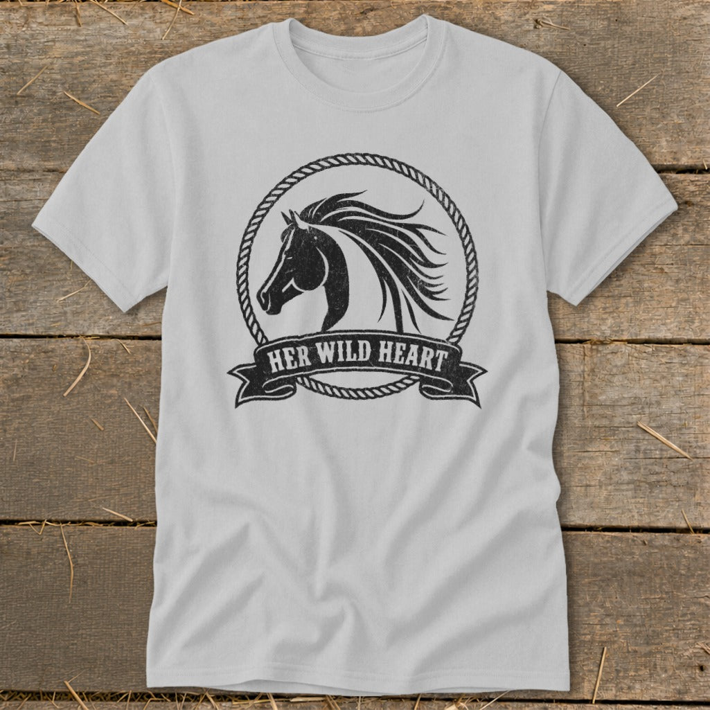 Light gray t-shirt with a black distressed horse head in a rope circle and "HER WILD HEART" banner.