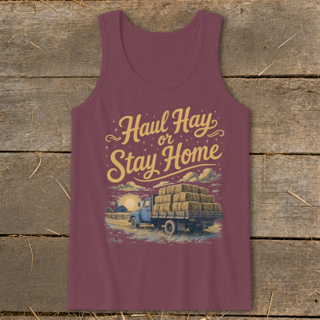 Burgundy tank top with "Haul Hay or Stay Home" text and truck loaded with hay bales.