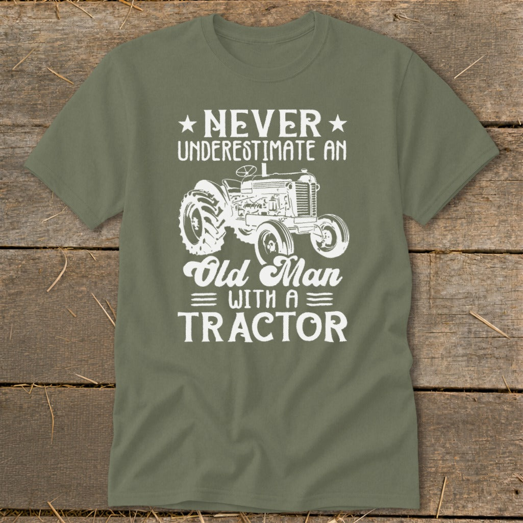 Olive green t-shirt with "Never Underestimate An Old Man With A Tractor" and tractor graphic.