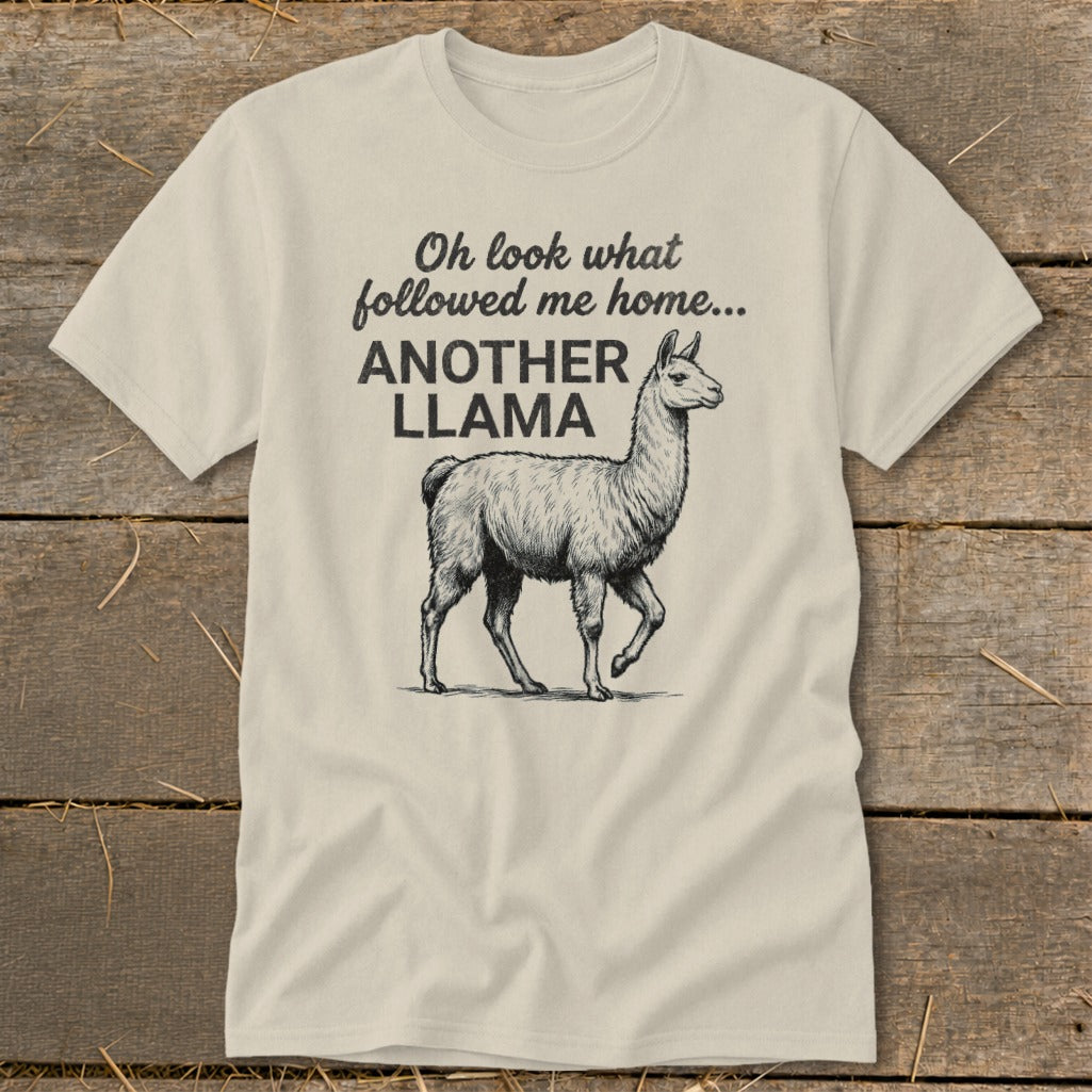 Cream t-shirt with a sketch of a llama and text "Oh look what followed me home... ANOTHER LLAMA".